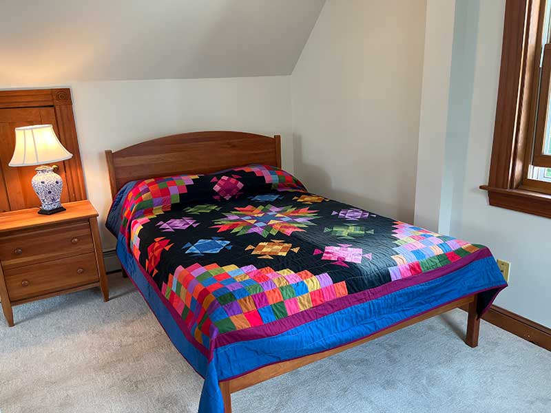 Open Bedroom with full bath on 3rd Floor w/ windows on three sides.